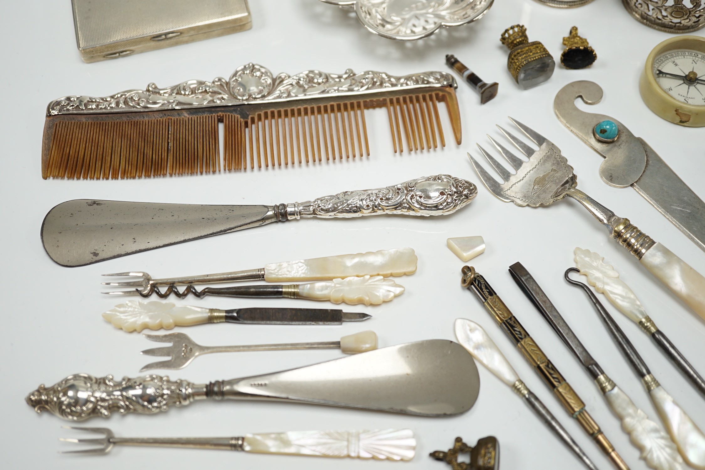 A group of assorted small silver and white metal items, including a small late Victorian clover shaped nut dish, napkin rings, pill box, etc and other items including two gilt metal mounted chalcedony fob seals.